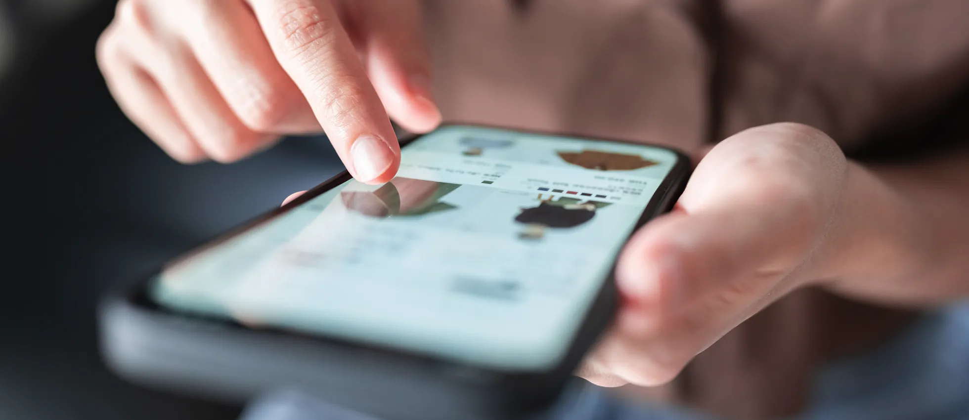 an image of a woman shopping on a mobile phone