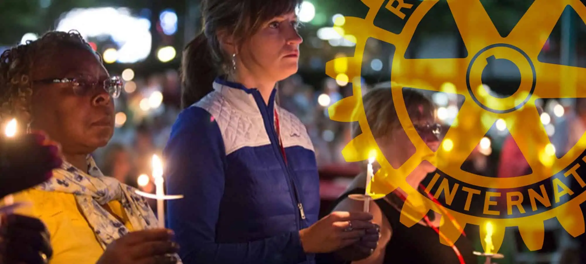 an image of two woman holding candles