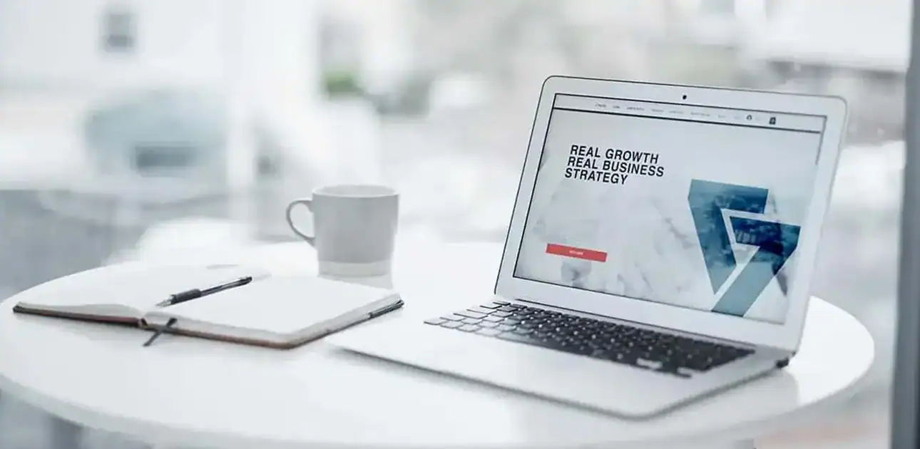 an image of a laptop on a white table